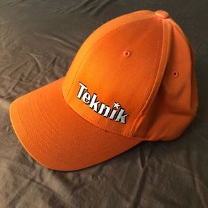 Orange Teknik Hat.   Climbing Hold Company Logo